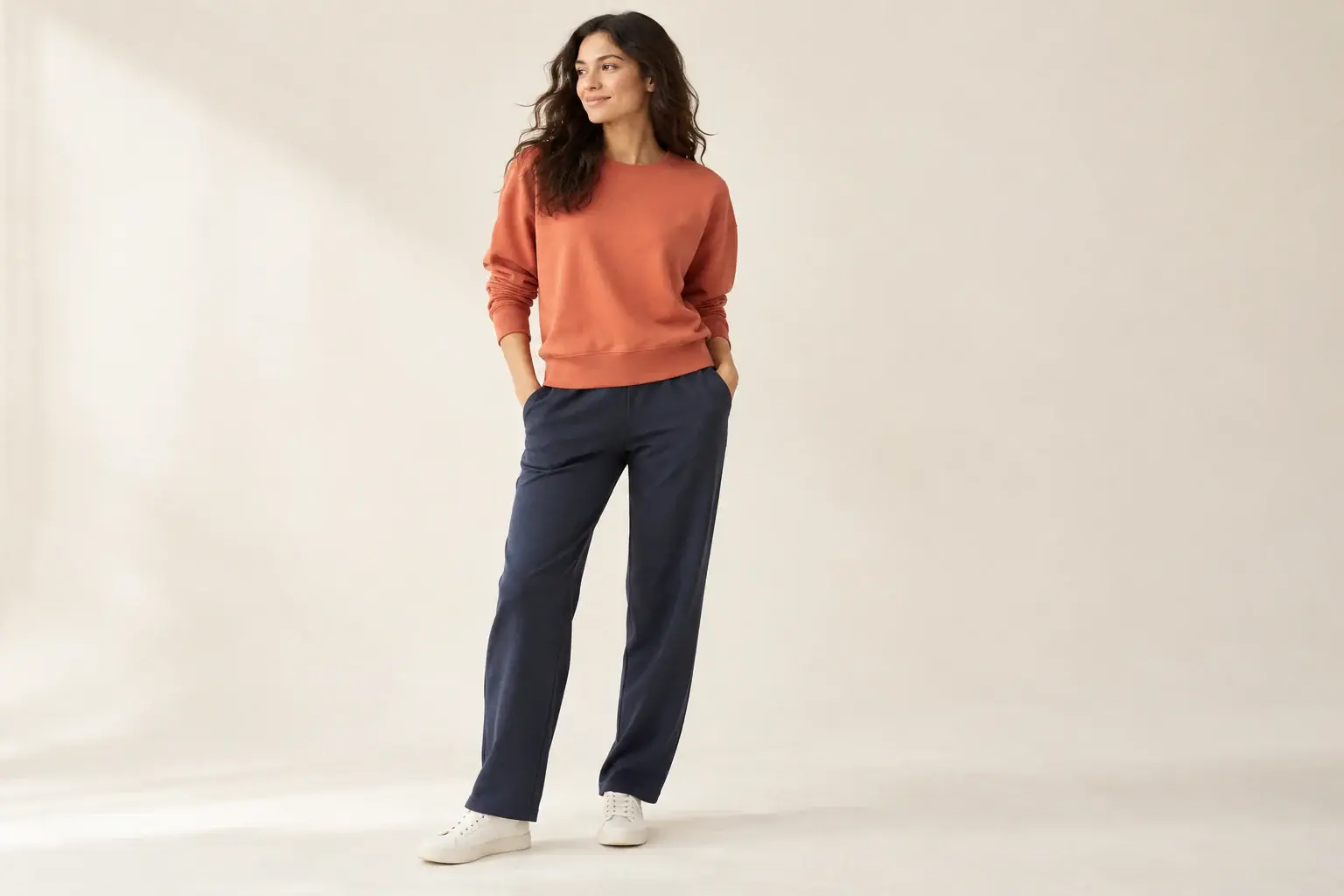 Woman wearing an orange sweatshirt
